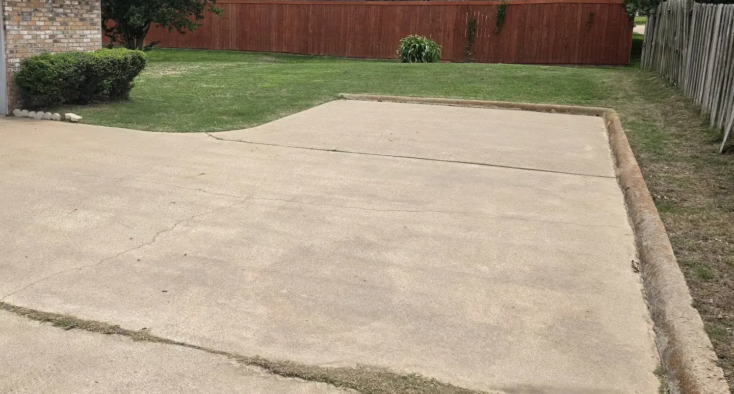 After: the same concrete driveway, clean and even in color