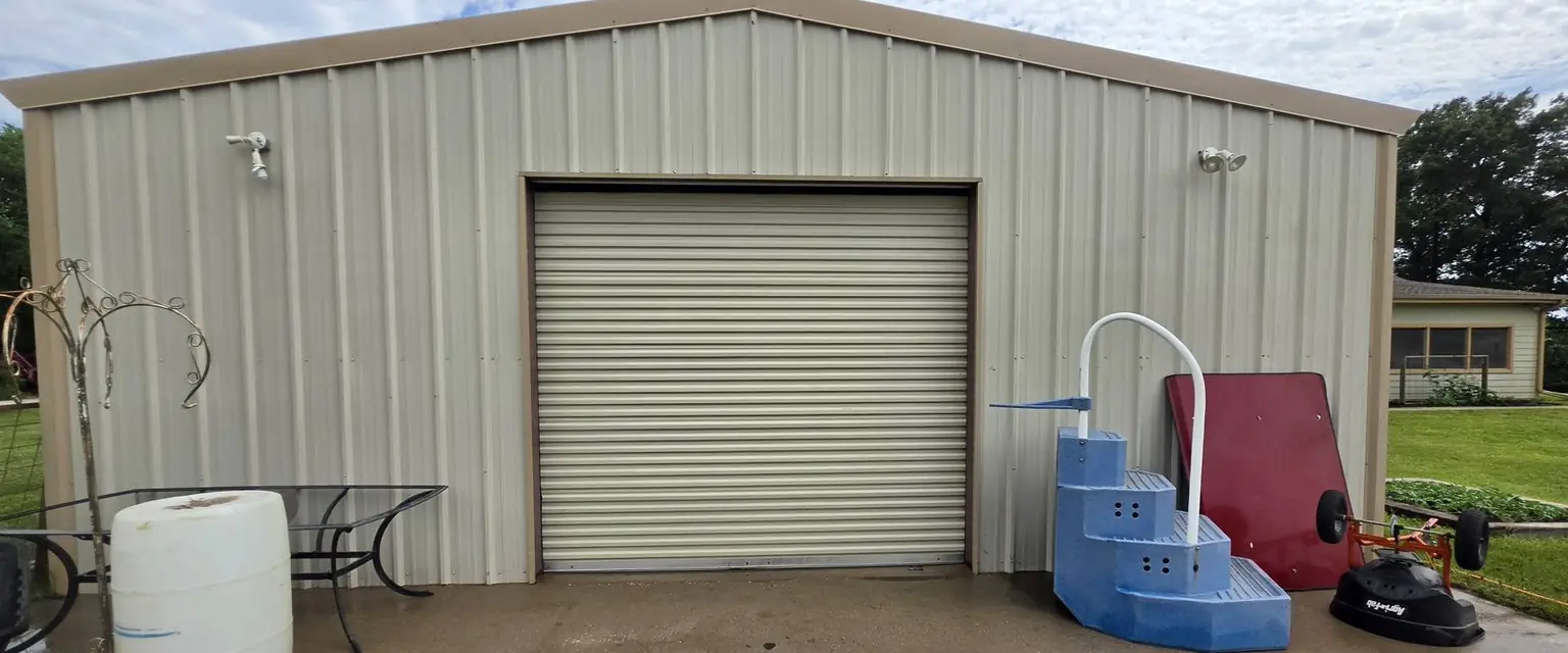 After: the same metal shop building, clean