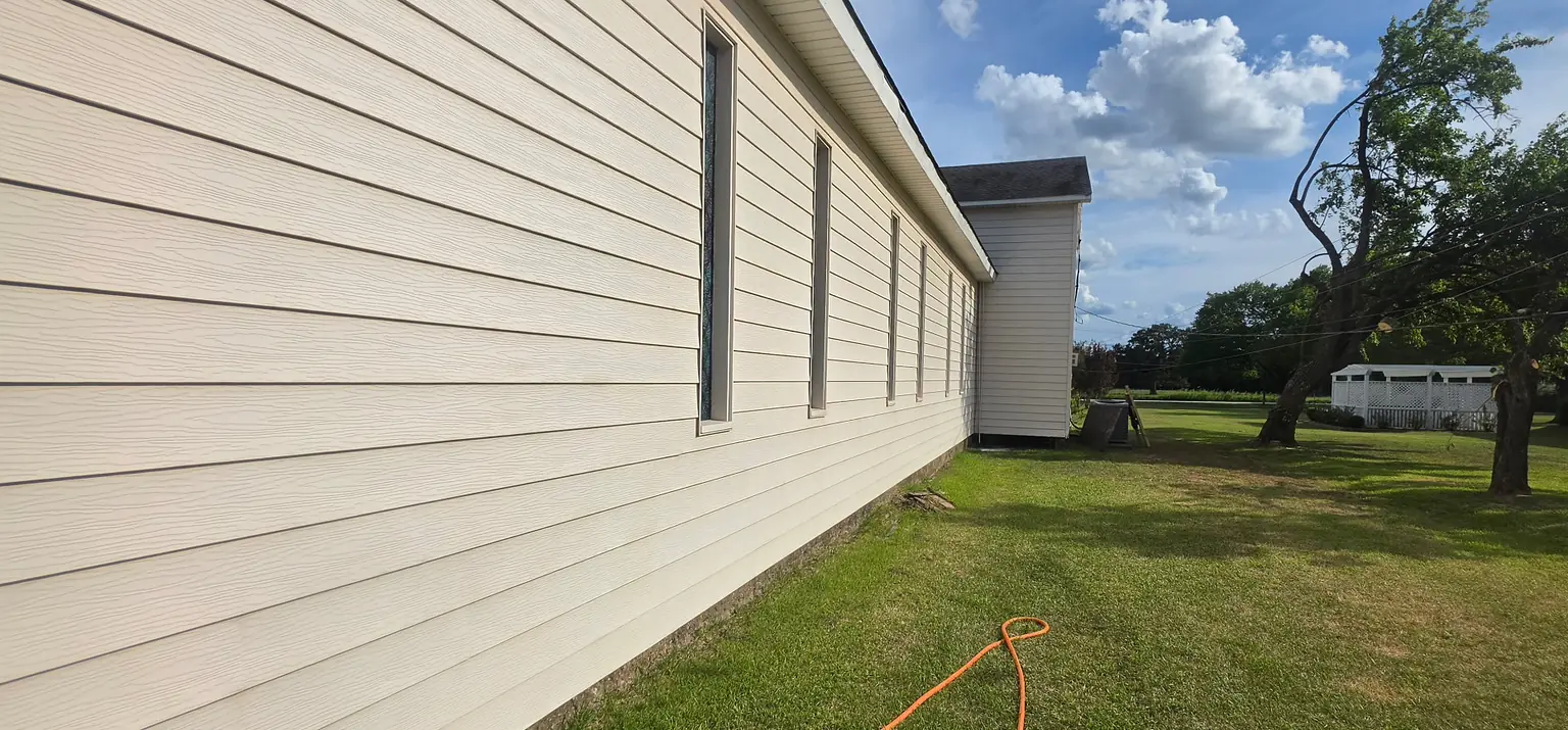 After: the same siding wall, clean