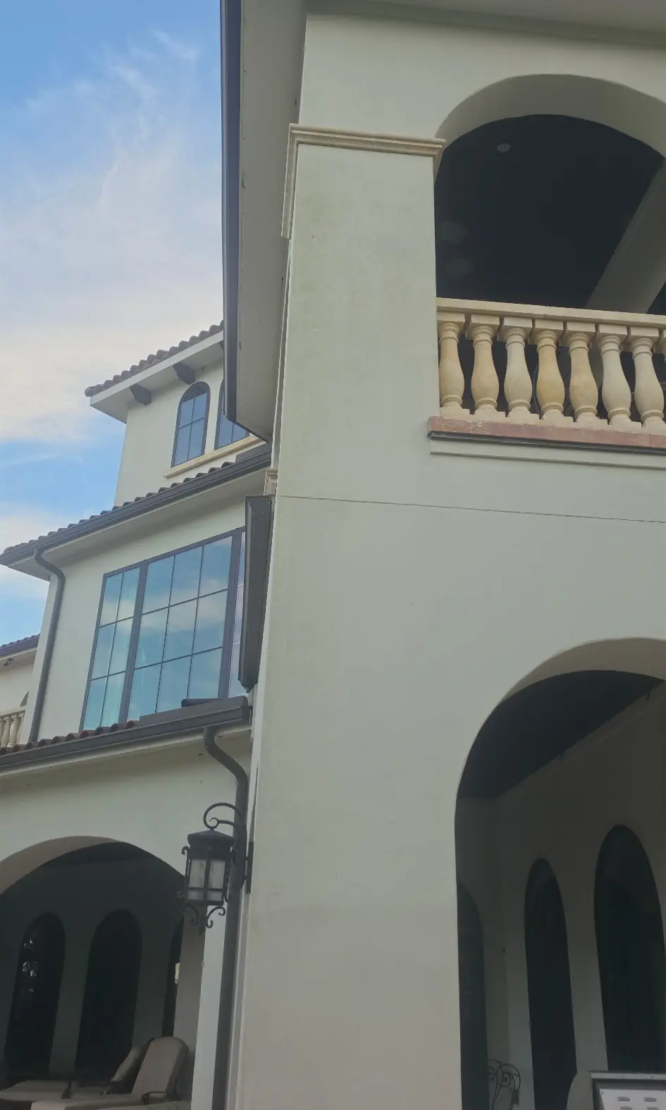 Before: stucco tower with a gray-green film on the walls